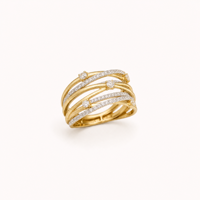 Gold-tone multi-row crossover ring on a warm white background
