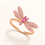 Pink dragonfly ring on a warm white background