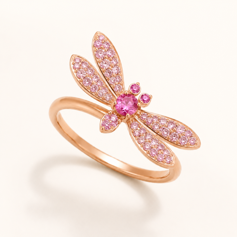 Pink dragonfly ring on a warm white background