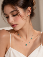 Model wearing a teal drop necklace